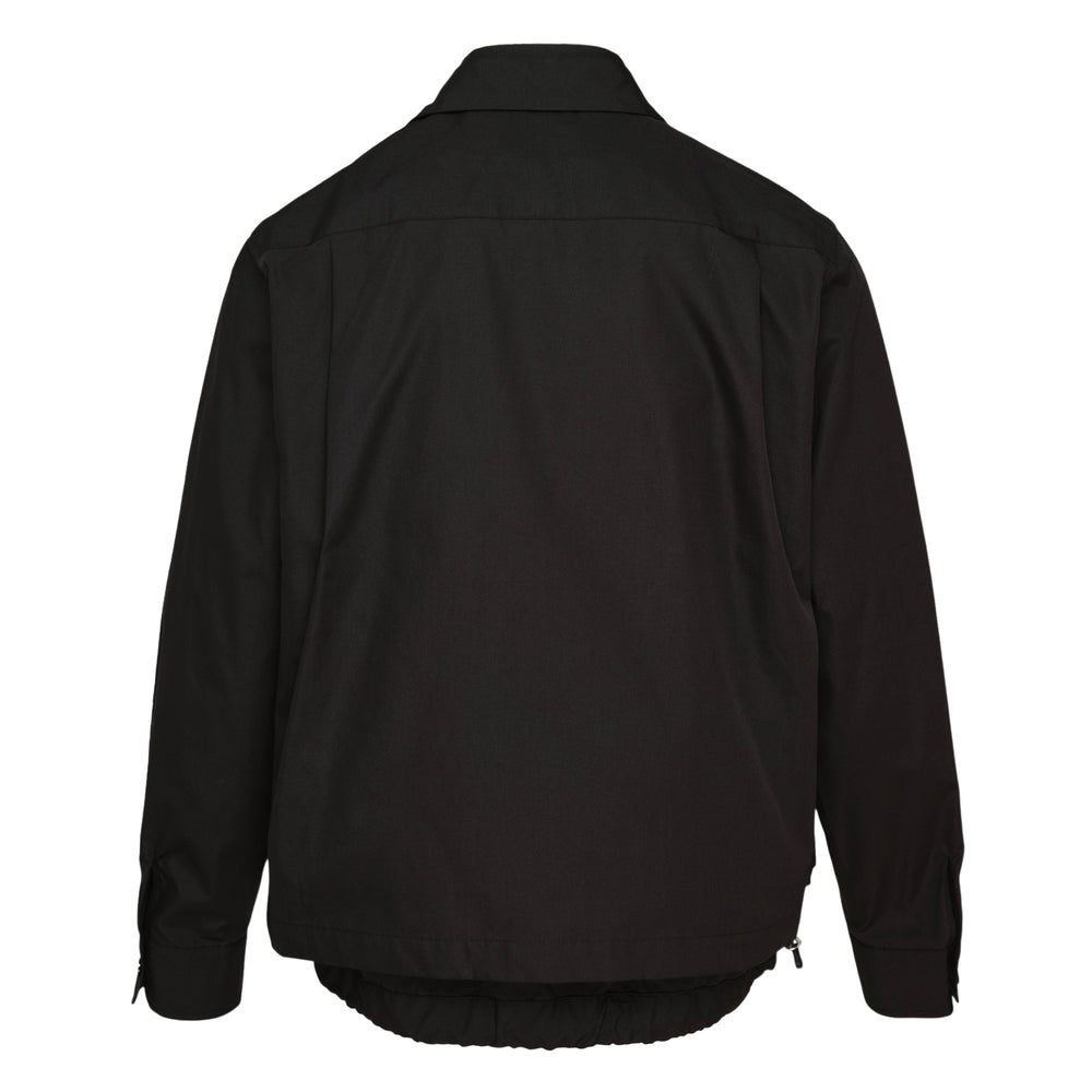 sacai Poplin Long Sleeve Shirt in black, featuring a double-layered button-front placket, dual chest patch pockets, spread collar, and elasticated ribbed hem, shot flat on a white background