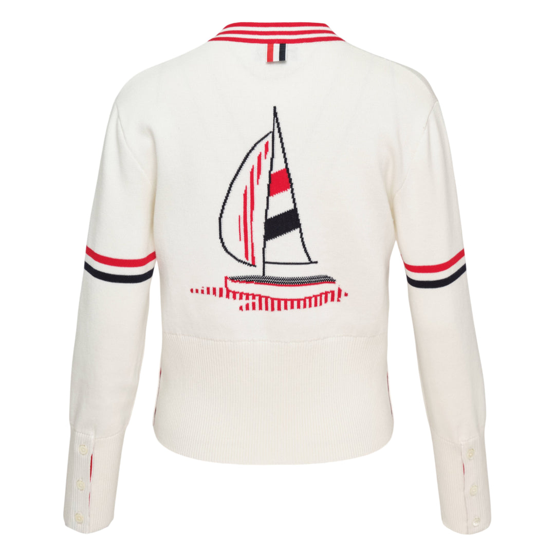 Thom Browne Sailboat Jacquard V-Neck Cardigan in navy with white contrast tipping, red, white, and blue sleeve stripe, and four-button front fastening