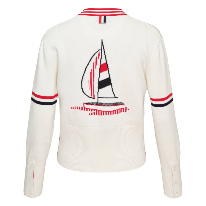 Thom Browne Sailboat Jacquard V-Neck Cardigan in navy with white contrast tipping, red, white, and blue sleeve stripe, and four-button front fastening