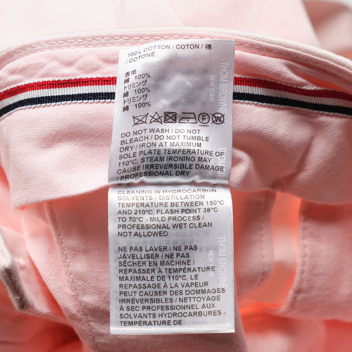Thom Browne Beltloop Chino Pants in blush pink cotton twill, featuring a straight-leg silhouette with front creases, belt loop waistband, and cuffed hems