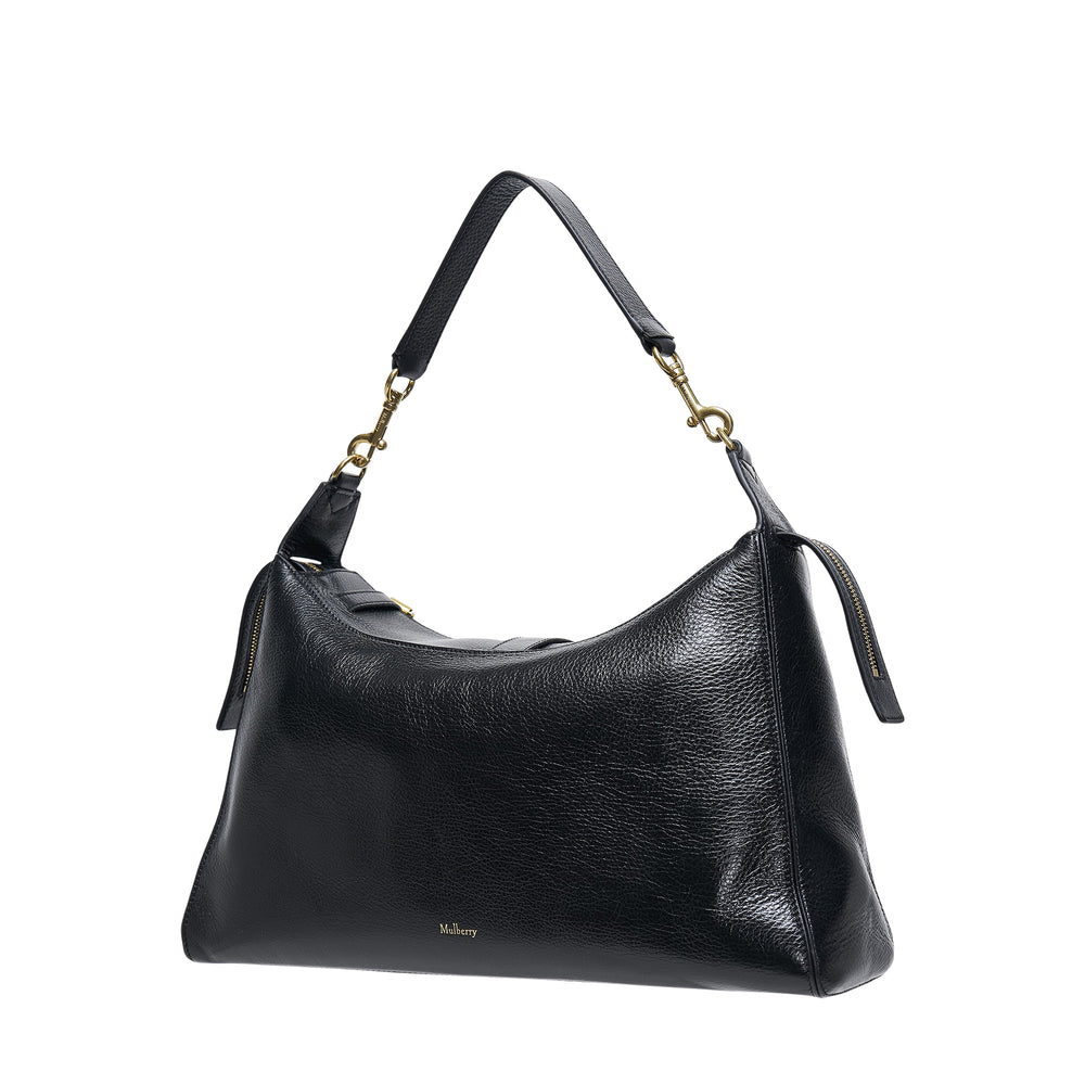 Mulberry Roxanne Medium Shoulder Bag in black pebbled leather with antique brass buckle hardware, two front patch pockets, and an adjustable single shoulder strap