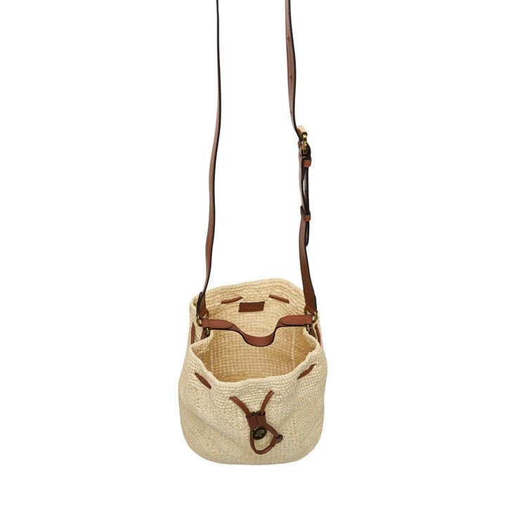 Mulberry crochet raffia bucket bag with tan leather drawstring closure, postman's lock charm, and adjustable crossbody strap on a white background