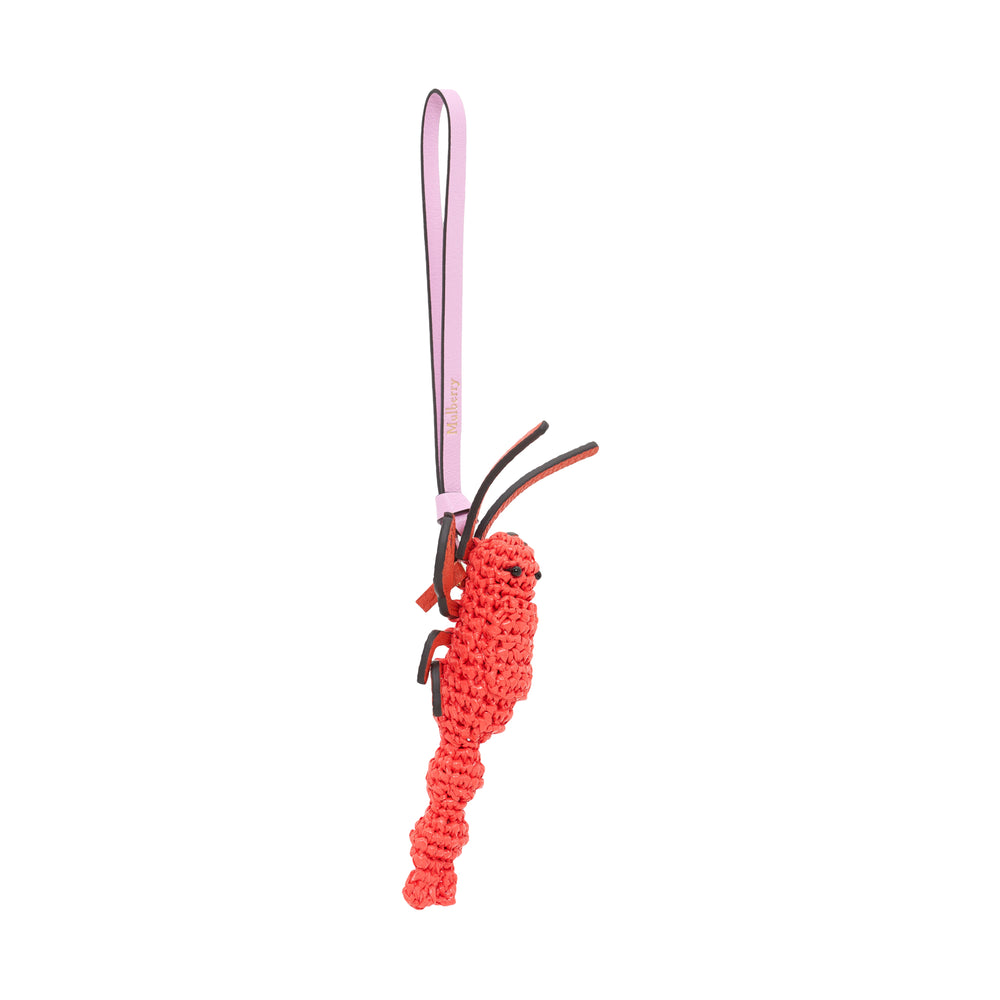 Mulberry Lobster Bag Charm featuring a coral-red crochet body on a flat leather lobster silhouette with beaded eyes, suspended from a lilac leather Mulberry-branded wrist strap
