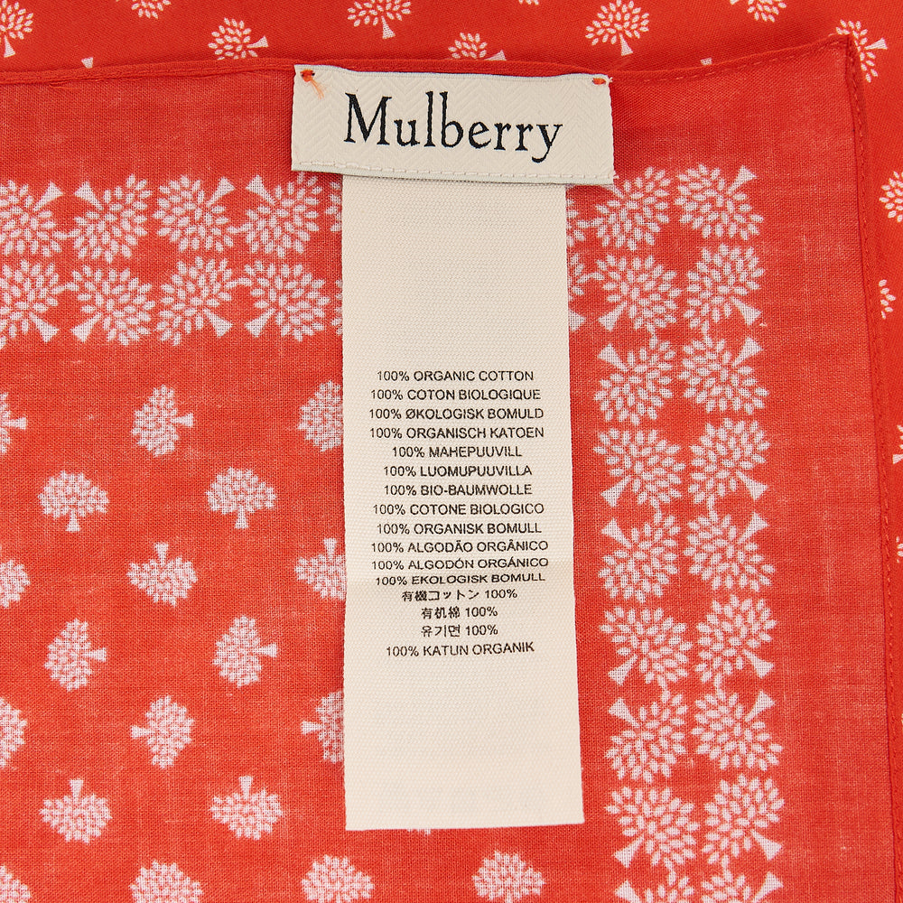 Mulberry scarlet cotton square scarf with an all-over ivory Mulberry tree motif repeat print and a delicate floral border, laid flat