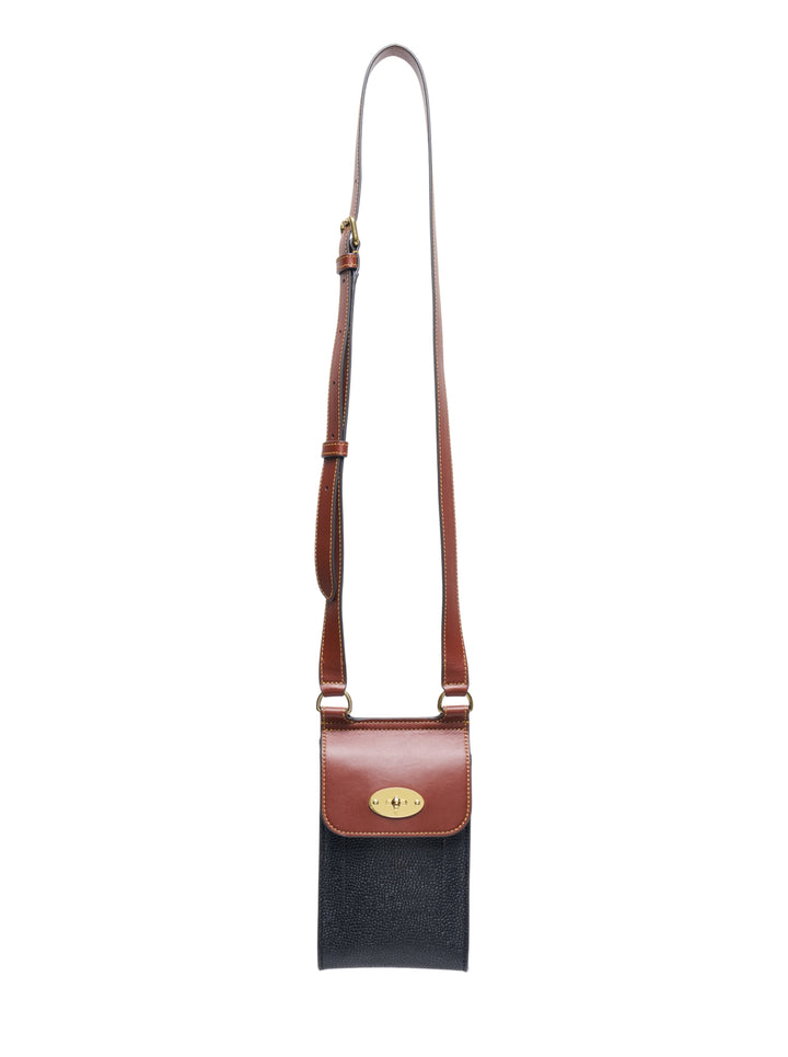 Mulberry Mini Antony Phone Pouch in navy Scotchgrain with tan leather flap, antique brass Postman's Lock closure, and long adjustable crossbody strap