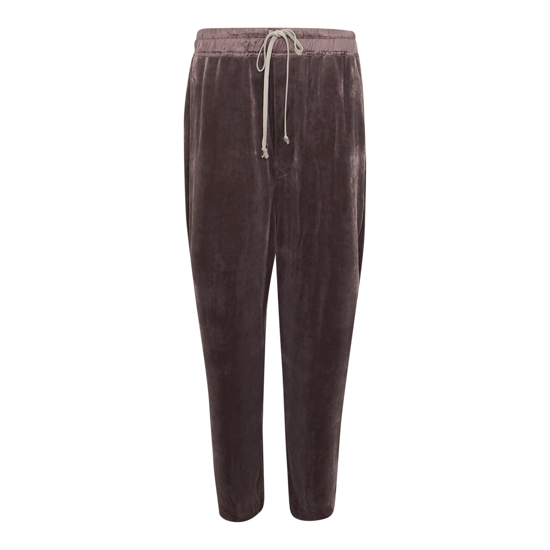 Rick Owens Drawstring Astaires Cropped Pants in black, displayed flat, featuring a dropped-crotch silhouette, pressed front crease, elasticated waistband with contrast ivory drawstring, and tapered cropped hem.