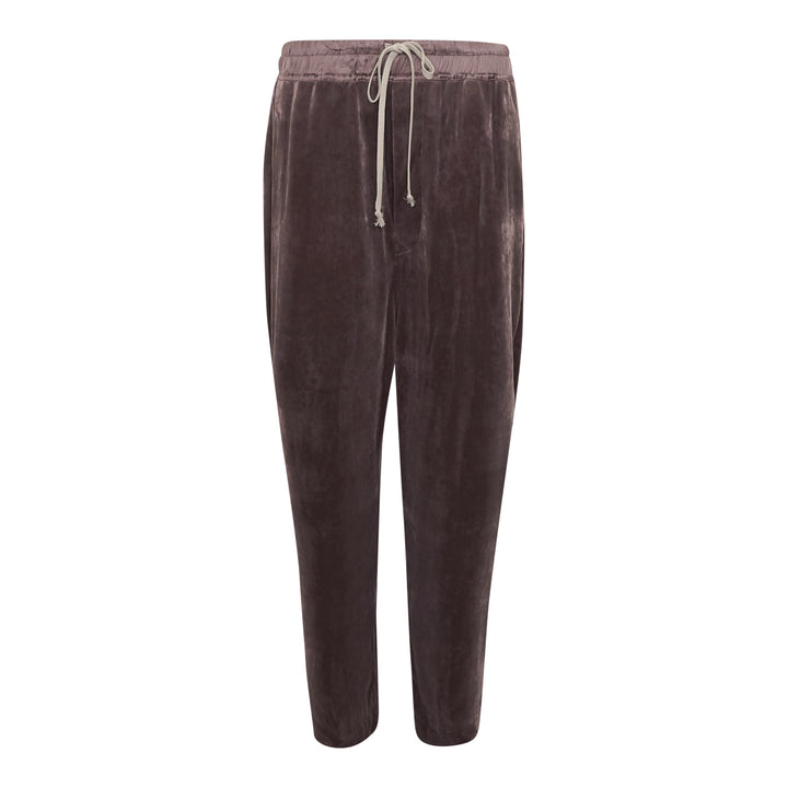 Rick Owens Drawstring Astaires Cropped Pants in black, displayed flat, featuring a dropped-crotch silhouette, pressed front crease, elasticated waistband with contrast ivory drawstring, and tapered cropped hem.