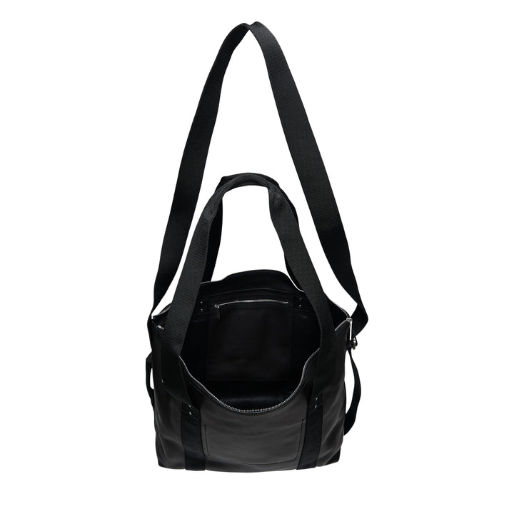Rick Owens Grainy Cow Leather Tote in black, shown front-facing with dual grosgrain shoulder straps, zip closure, front flat pocket, and a detachable crossbody strap