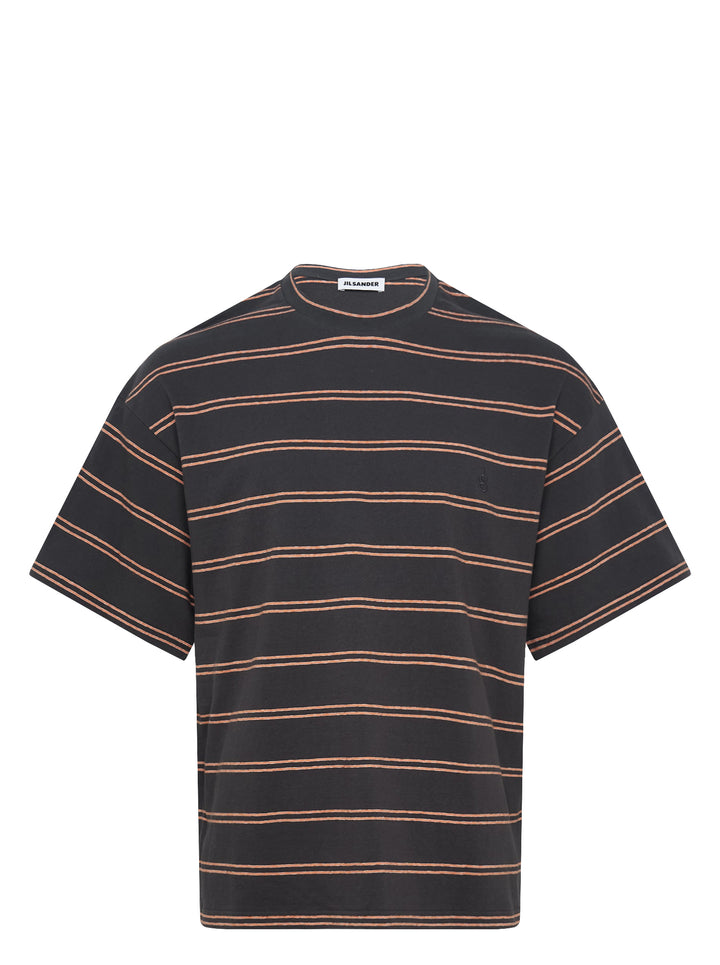 Jil Sander charcoal short sleeve t-shirt with terracotta horizontal pinstripes and tonal embroidered monogram at chest, crew neckline, oversized fit, on white background