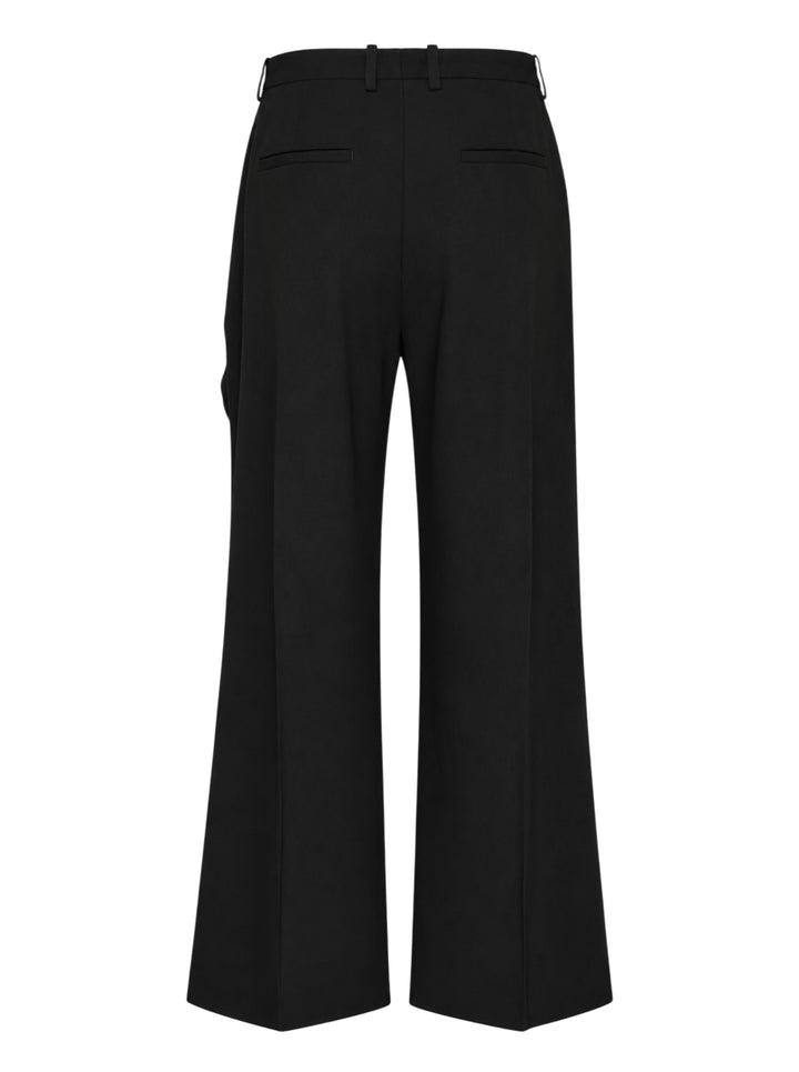 Jil Sander black wide-leg trousers with a cascading draped panel and button-fastened waistband, shown from the front - view 2