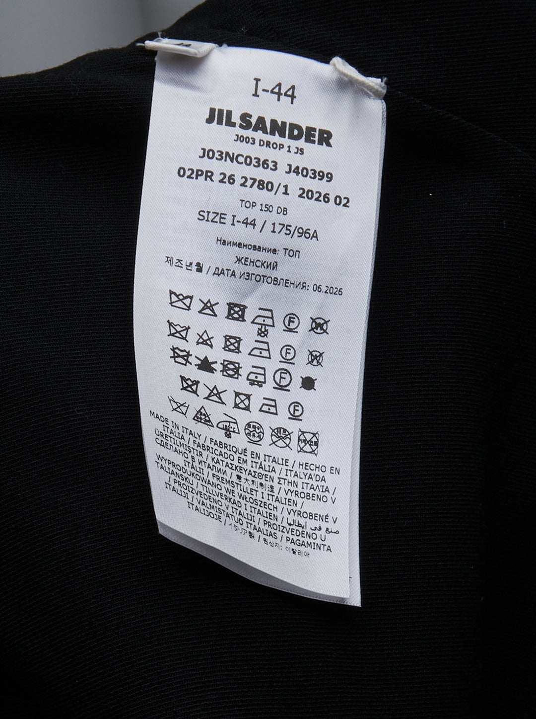 Jil Sander black strapless top with structured bodice, column silhouette, and double split hem detail, shown front-facing on white background - view 3