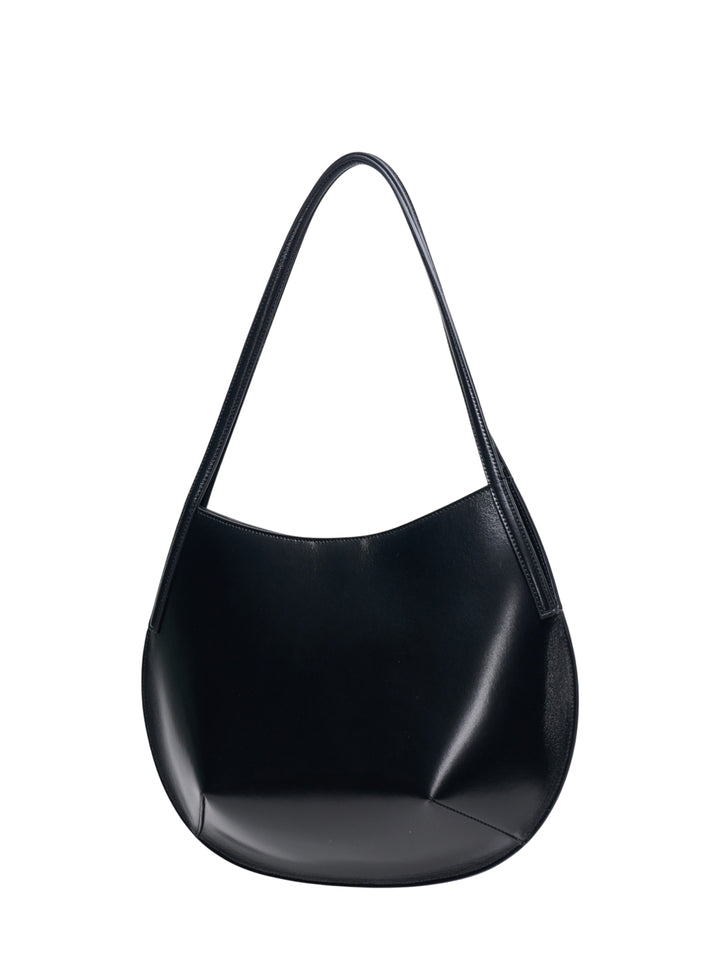 Jil Sander Kante Shoulder Bag in black shiny lambskin leather with a crescent silhouette and single flat shoulder strap, front view on white background - view 2