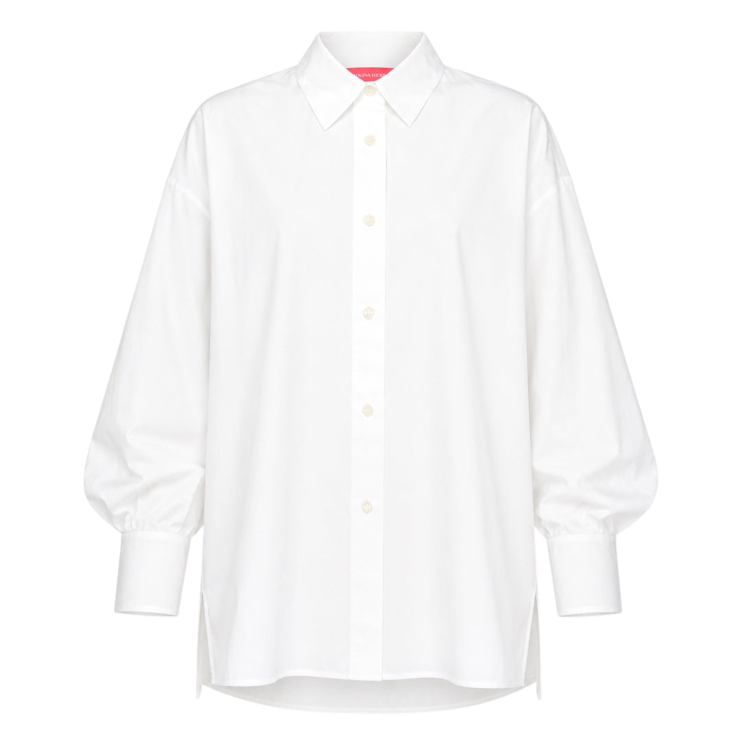 Carolina Herrera Clara Shirt in white cotton with voluminous bishop sleeves, point collar, and pearlescent button-front placket, displayed flat on a white background