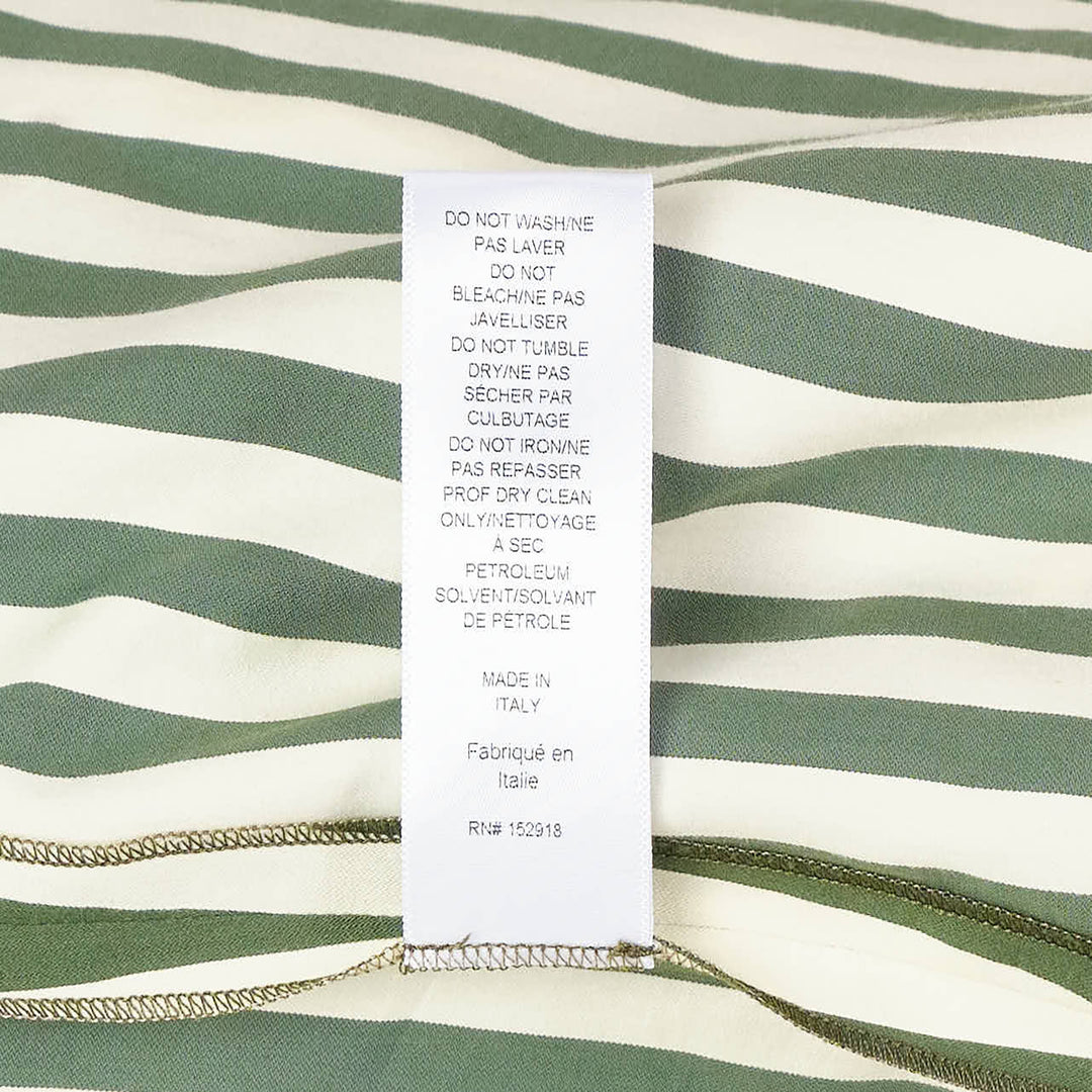 Carolina Herrera Clara Shirt in forest green and ivory vertical stripes, featuring an oversized fit, voluminous bishop sleeves with buttoned cuffs, and a button-front fastening