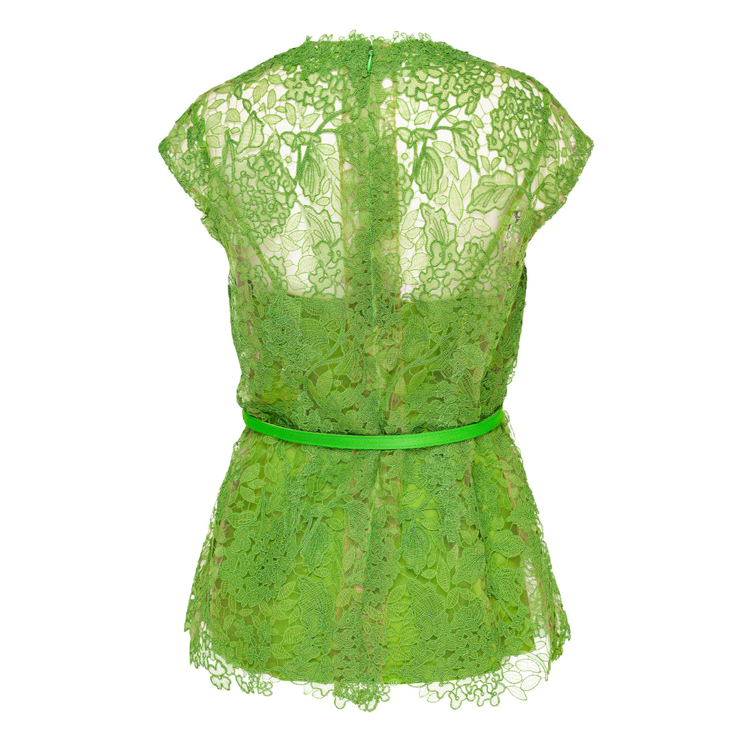 Carolina Herrera bright green floral guipure lace belted crew neck top with cap sleeves, sheer yoke, coordinating slim belt, and scalloped hem, displayed on a white background