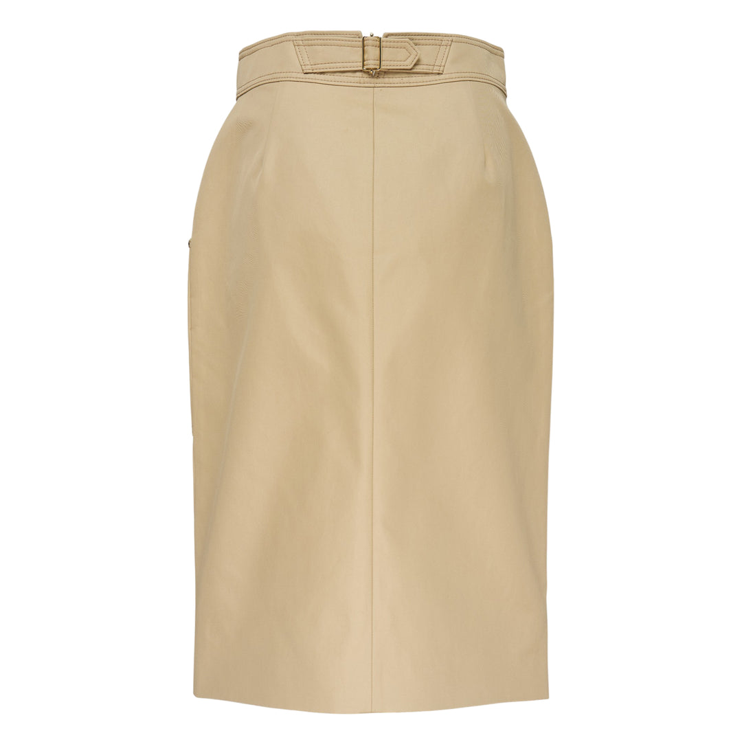 Carolina Herrera camel leather belted pencil skirt with contrast topstitching, hip patch pockets with gold-tone studs, integrated self-fabric belt with gold buckle, and a front centre slit at the hem