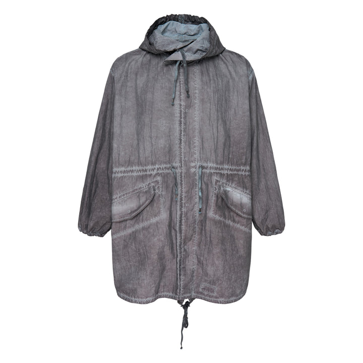 Maison Margiela treated cotton nylon parka coat in mineral-washed grey, featuring an adjustable drawstring hood, front zip with press-stud placket, large flap pockets, and an oversized silhouette with elasticated cuffs