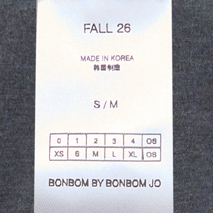Back view of Bonbom Shoulder-Tuck Sleeveless Sweat in heathered charcoal grey, showing structured shoulder tuck detail and embroidered logo at the hem