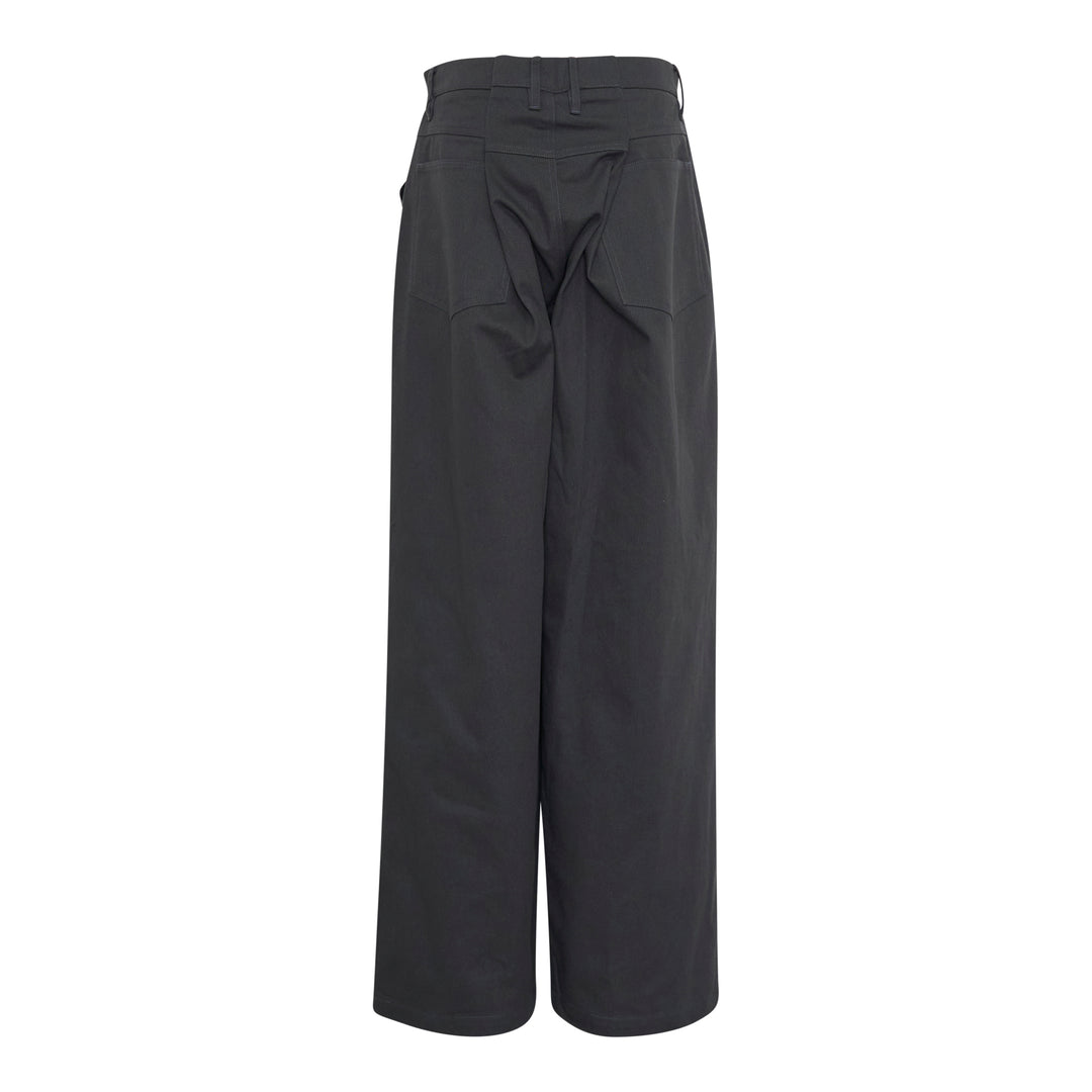 Bonbom Back Box Pleats Pants in deep charcoal — high-rise, wide-leg silhouette with button closure and copper rivets, front view on white background