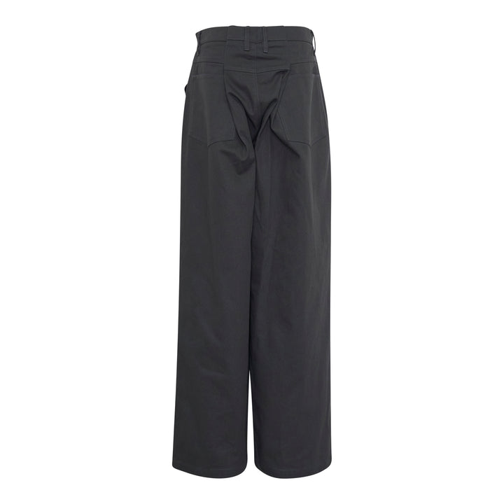 Bonbom Back Box Pleats Pants in deep charcoal — high-rise, wide-leg silhouette with button closure and copper rivets, front view on white background