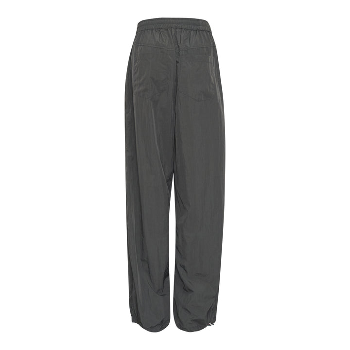 Bonbom Two-Tuck Track Pants in dark grey crinkle nylon, featuring a wide-leg silhouette, elasticated waistband, and sculptural front tuck detailing