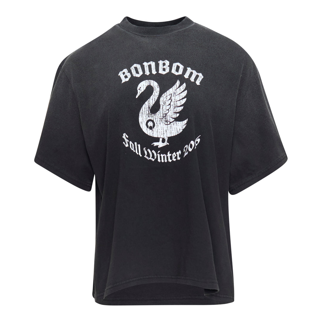 Bonbom Swan Vintage Effect Tee in garment-washed black, featuring a distressed white swan graphic with gothic blackletter text reading 'Bonbom Fall Winter 205', shown flat in an oversized boxy fit