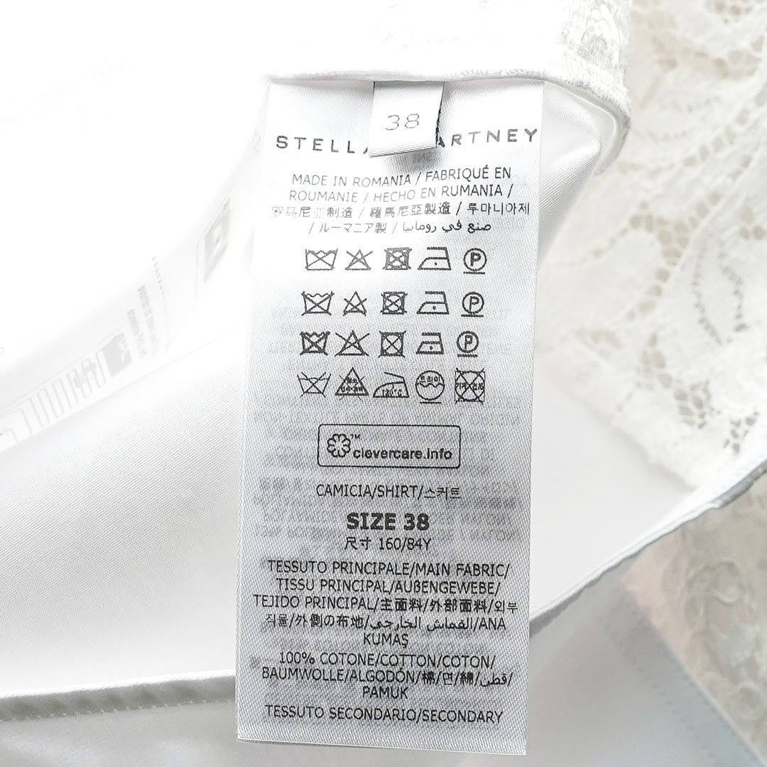 Stella McCartney white cotton poplin shirt with sheer floral lace panels at the shoulders, sides, and hem, featuring a pointed collar and mother-of-pearl button fastening - view 3