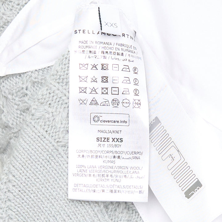 Stella McCartney Cable Knit Shirting Dress in sage green with diamond and honeycomb cable stitch sweater top layered over a white poplin shirt dress with buttoned placket