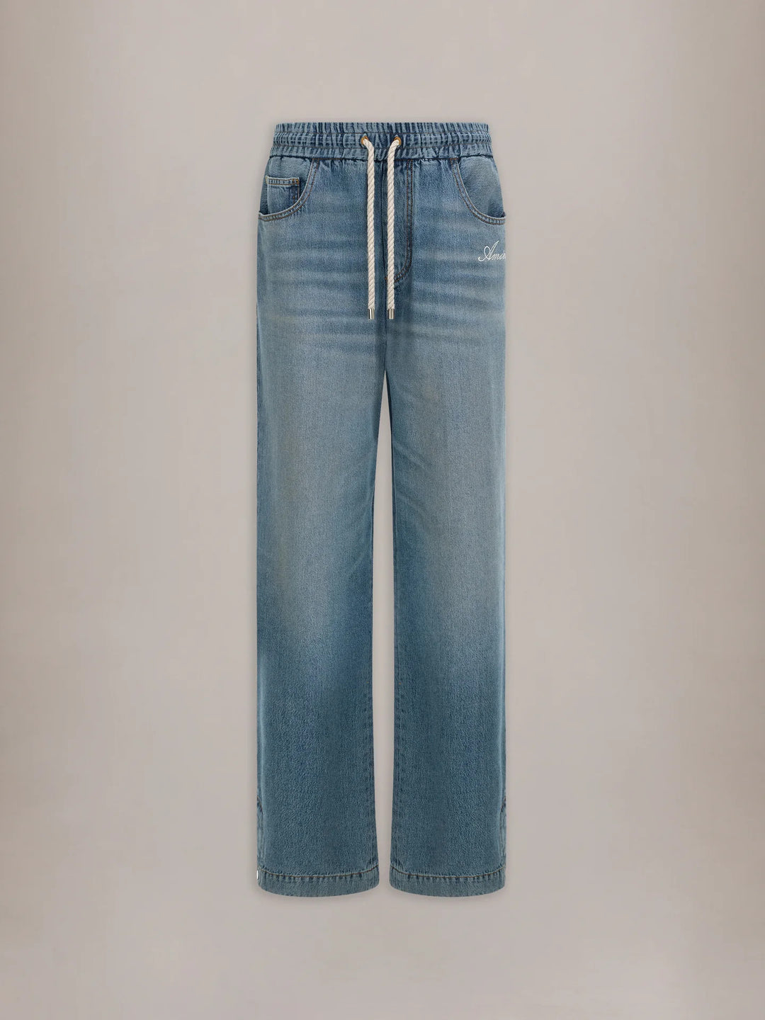Amiri baggy drawstring jeans in washed light-blue denim with an elasticated waist, white rope drawcord and embroidered script logo at the hip