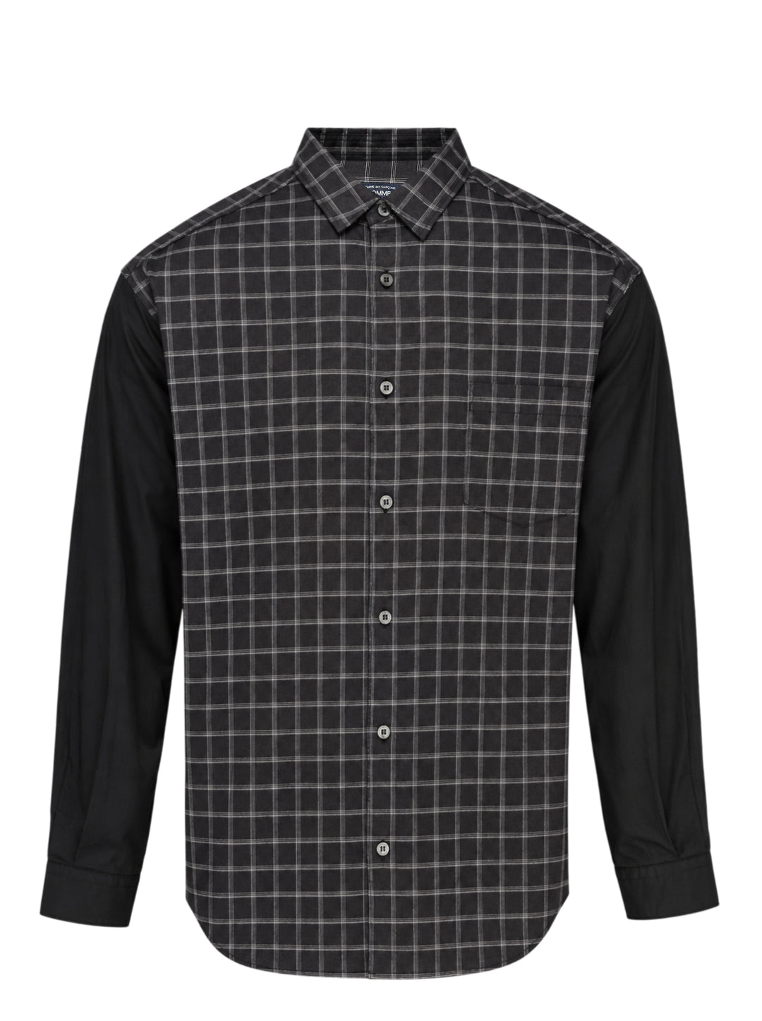 Comme des Garçons Homme long sleeve shirt with dark windowpane check cotton body and contrast solid black cotton broad cloth sleeves, shown flat on a white background