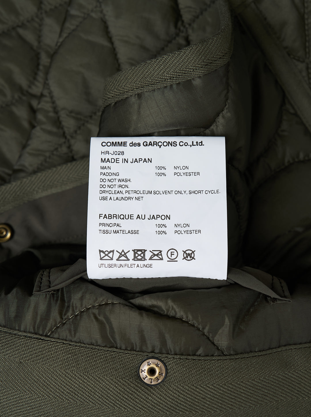 Olive green quilted ripstop nylon jacket with mixed diamond and wave quilting, collarless neckline, snap front and two patch pockets - view 3