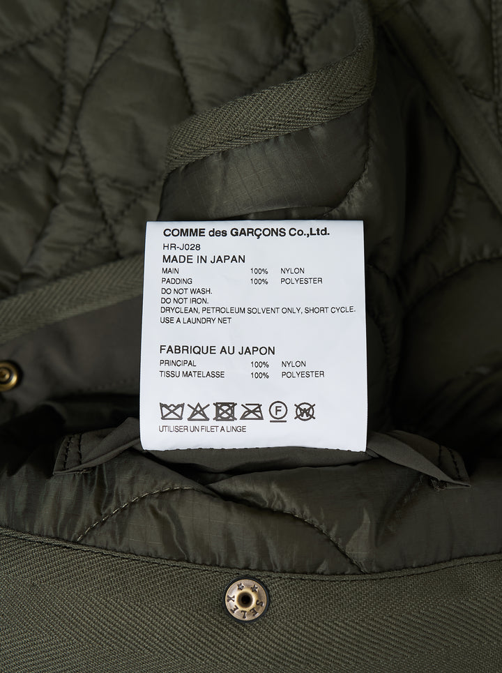 Olive green quilted ripstop nylon jacket with mixed diamond and wave quilting, collarless neckline, snap front and two patch pockets - view 3