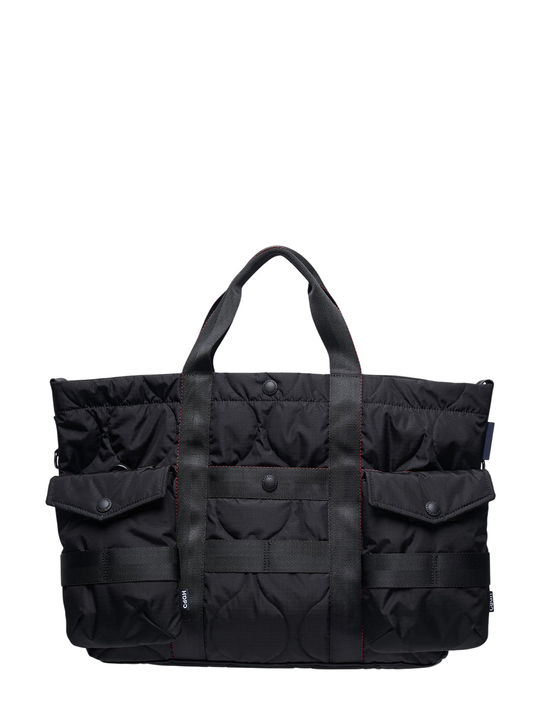 Comme des Garçons Homme black quilted nylon duck tote bag with four snap-fastened exterior pouches and webbing strap grid overlay, front view