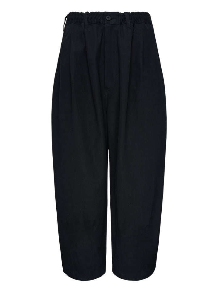 Comme des Garçons Homme black cotton twill pants with pleated front, elasticated waistband and wide cropped legs