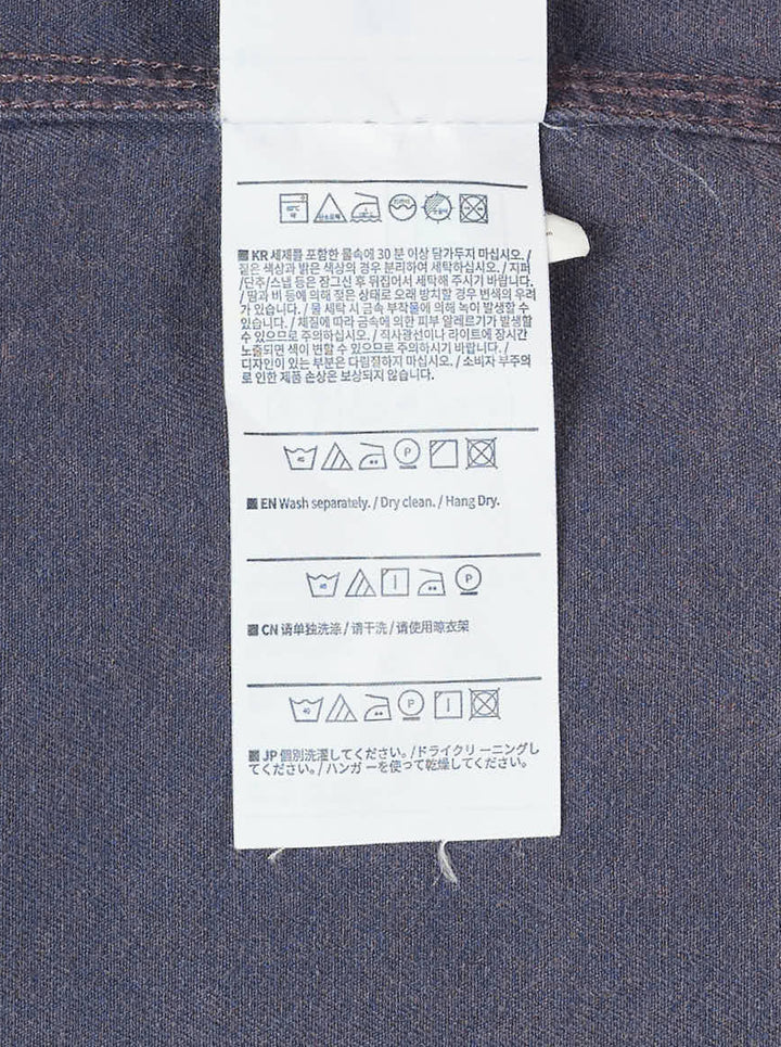 thisisneverthat Washed Twill Long Sleeve Shirt in faded charcoal, front view showing full button placket, chest patch pocket with embroidered script logo, and relaxed oversized silhouette - view 3