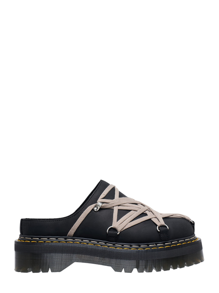 Rick Owens x Dr. Martens Quad Sole Megalace flatform mule in black leather with taupe multi-strand cord lacing, silver hardware, and chunky ridged platform sole with yellow stitching