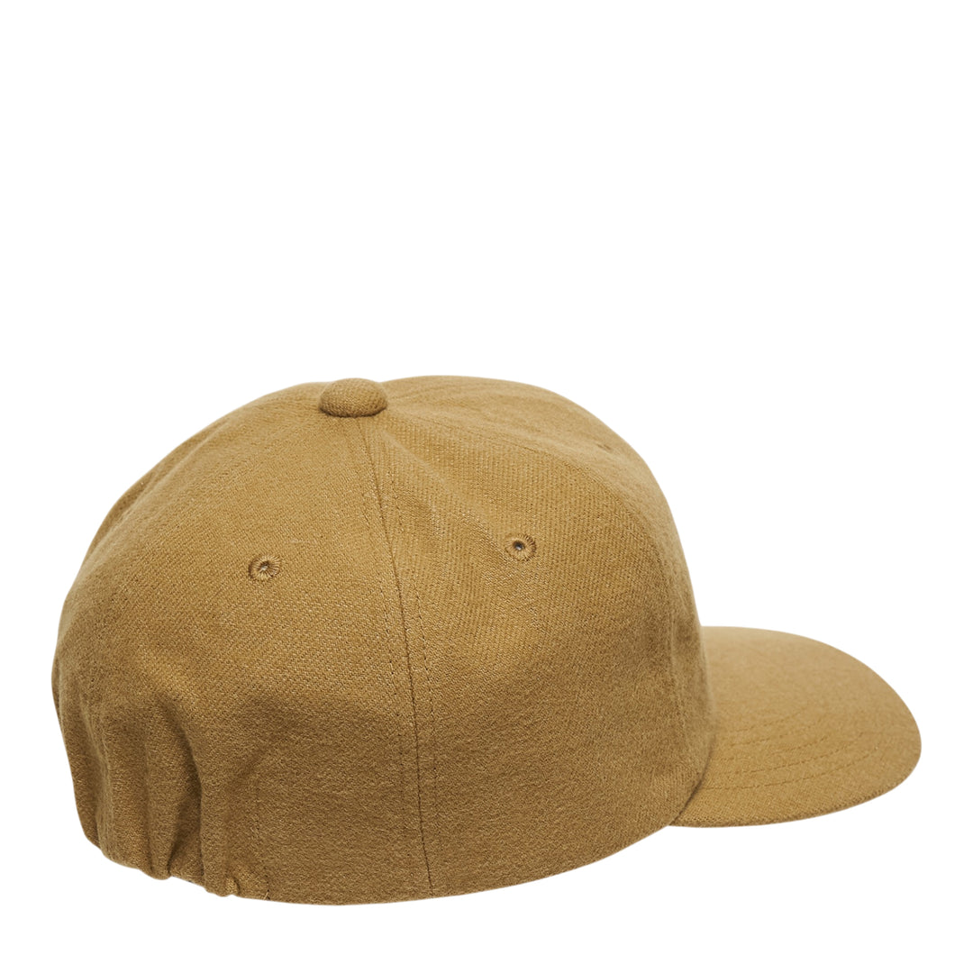 visvim Fowler Cap in tan wool-linen blend with cream chenille script V appliqué on the front panel and woven branding label on the brim - view 2