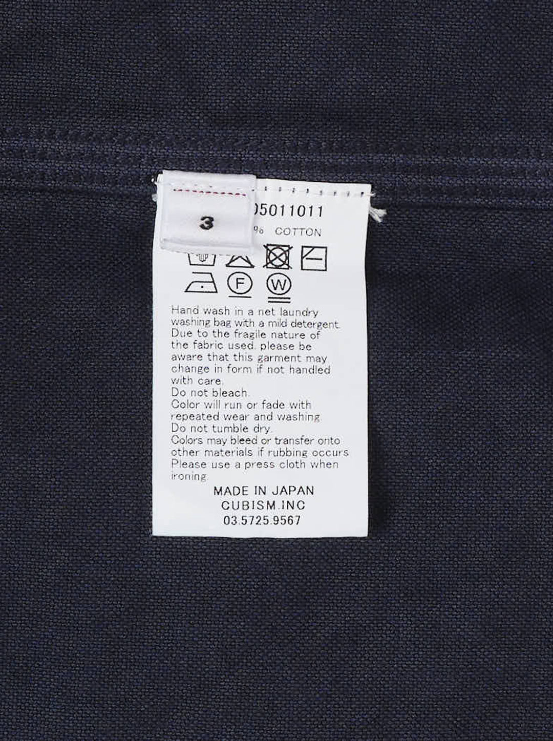visvim Larrikan long sleeve shirt in navy with two button-flap chest pockets and dark buttons, shown from the front - view 3