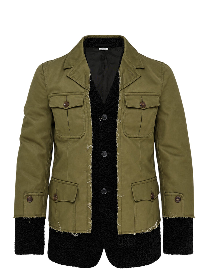 Comme des Garçons Homme Plus olive utility jacket with raw edges layered over a black textured inner jacket, shown from the front