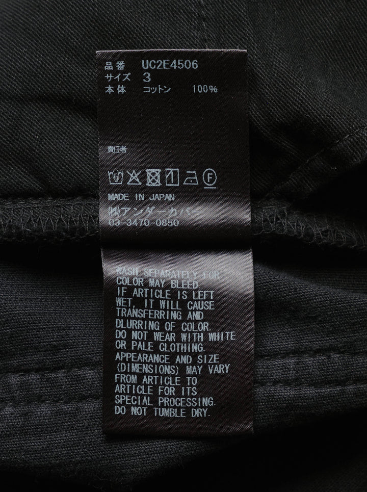 Undercover black corduroy pants with straight legs, knee seams and five-pocket styling, shown front view - view 3