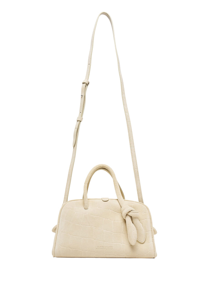 Jacquemus Le Petit Turismo top handle bag in cream croc-embossed suede with knotted handle detail and long adjustable crossbody strap