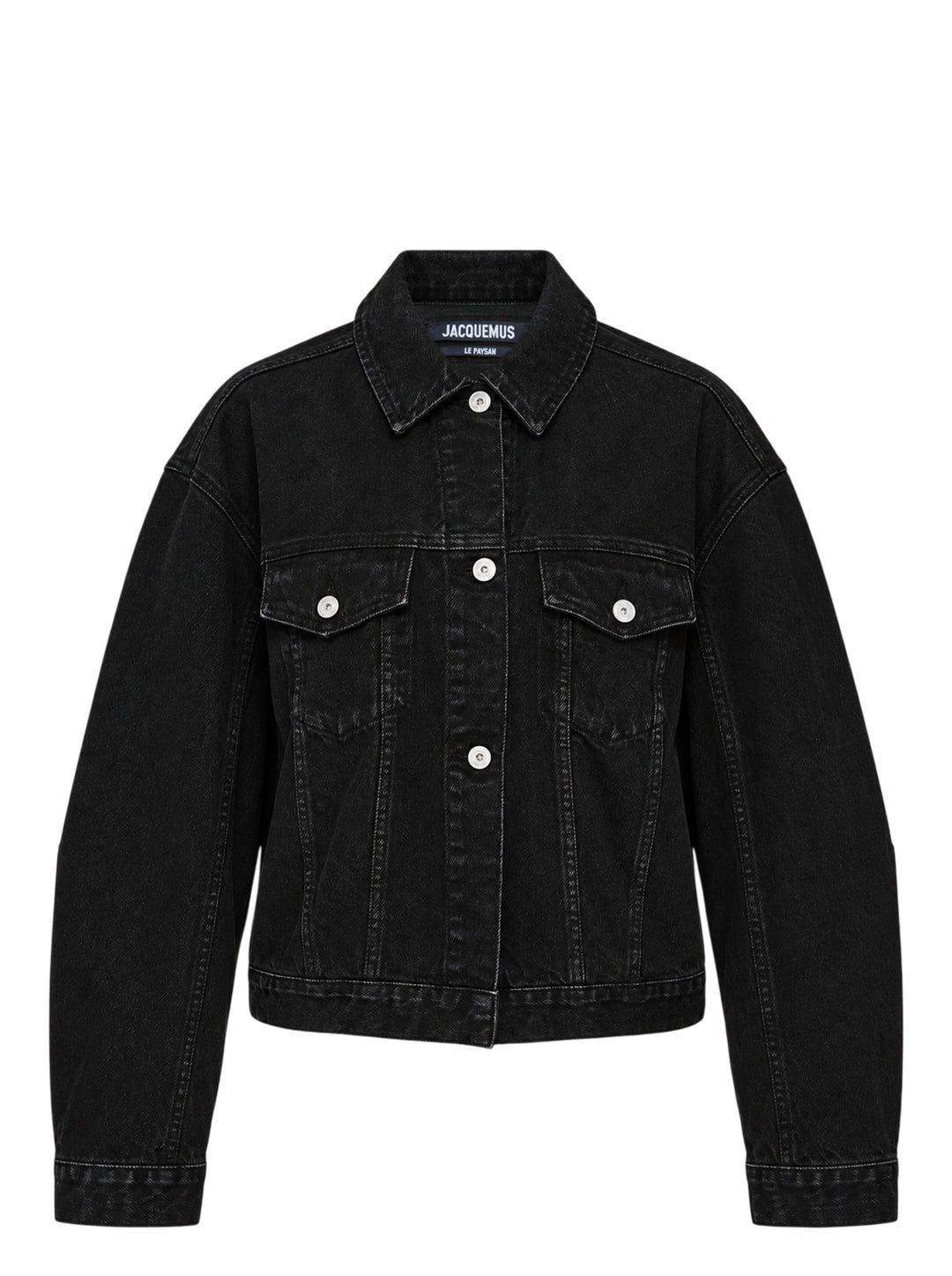 Jacquemus oversized black denim jacket with rounded sleeves, flap chest pockets and pearlised buttons, shown from the front