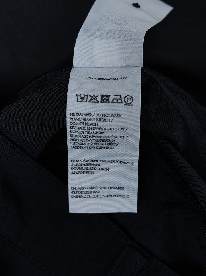 Jacquemus Oval Cargo Pants in navy with a high waist, side zip pockets and rounded balloon legs, shown from the front - view 4
