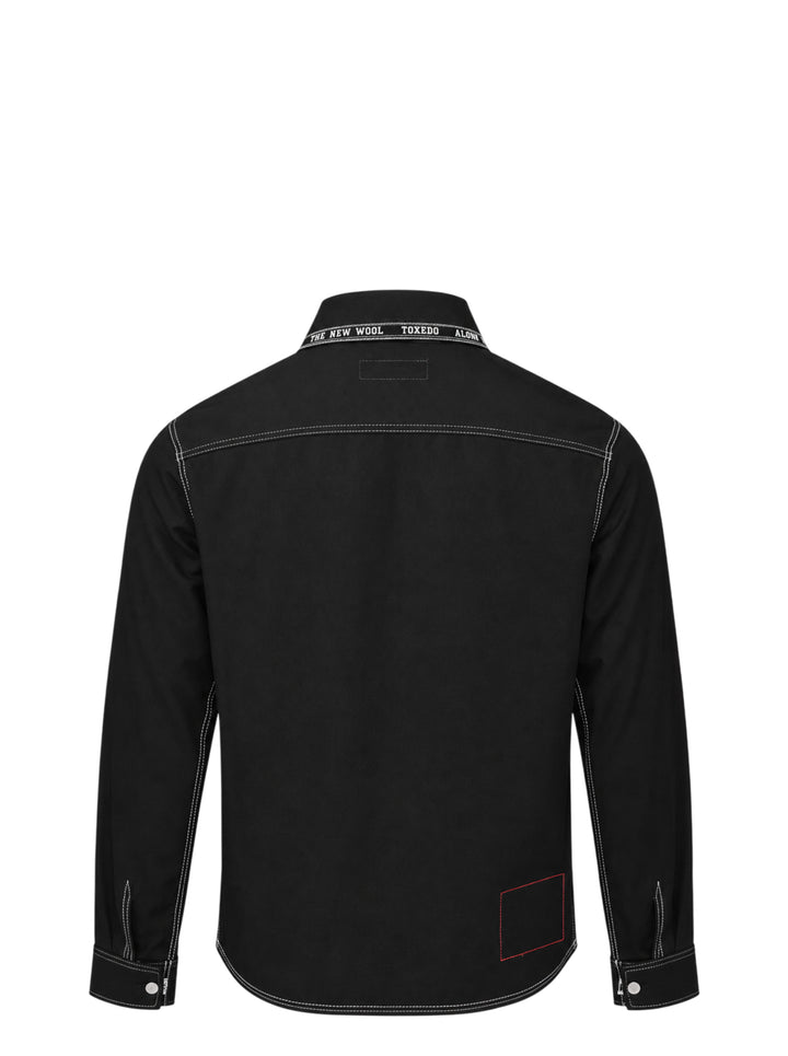 Junya Watanabe x Levi's black long-sleeve shirt with white contrast stitching, embroidered seagull motif across the chest, asymmetric chest pocket with red Levi's tab, and zip-detailed cuffs - view 2