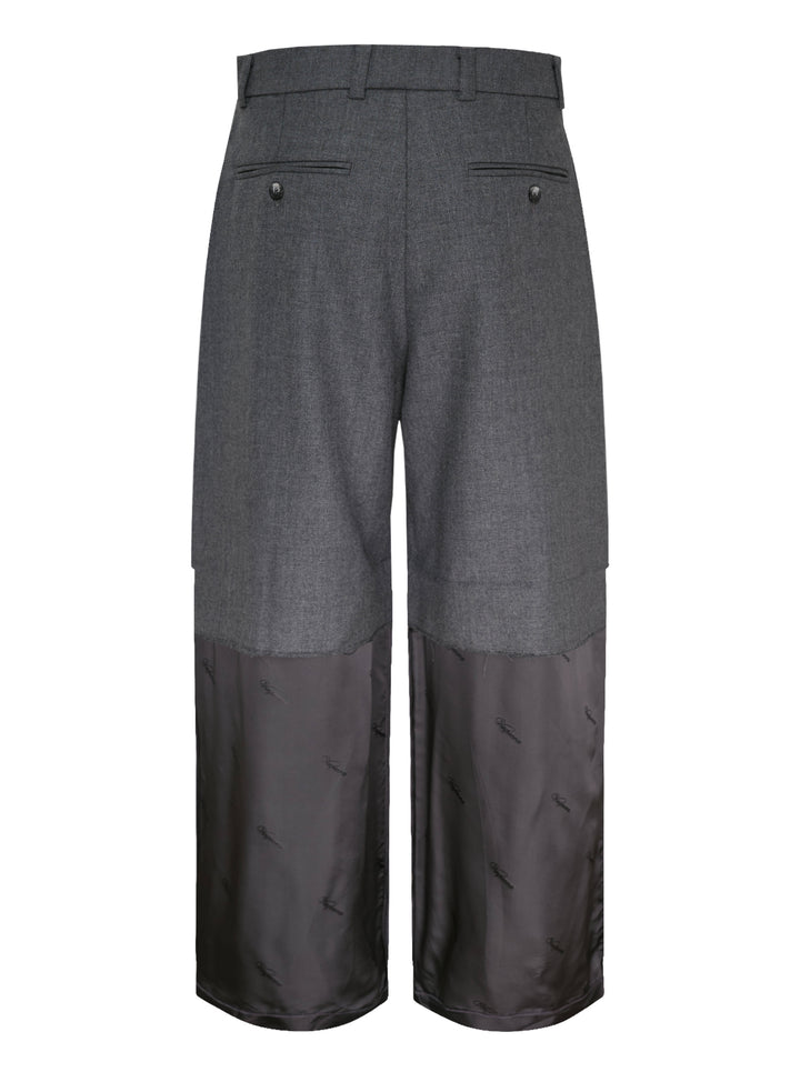 Vaquera women's wide-leg trousers in charcoal grey with pleated front and a raw-edged dark satin lower leg panel with tonal logo print - view 2