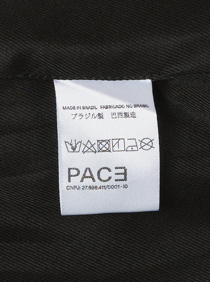 Black light wool long coat with notched lapels, snap button closure and jetted hip pockets, shown from the front - view 3