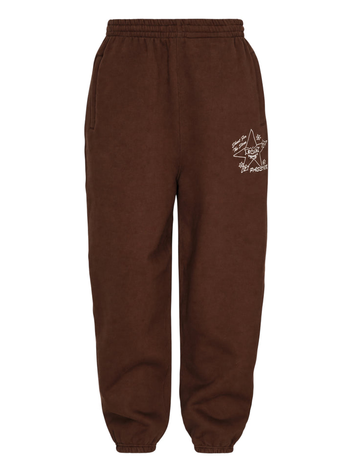 Passion Target Practice brown joggers with elasticated waist and cuffs, featuring a cream hand-drawn star graphic and Shoot For The Stars script