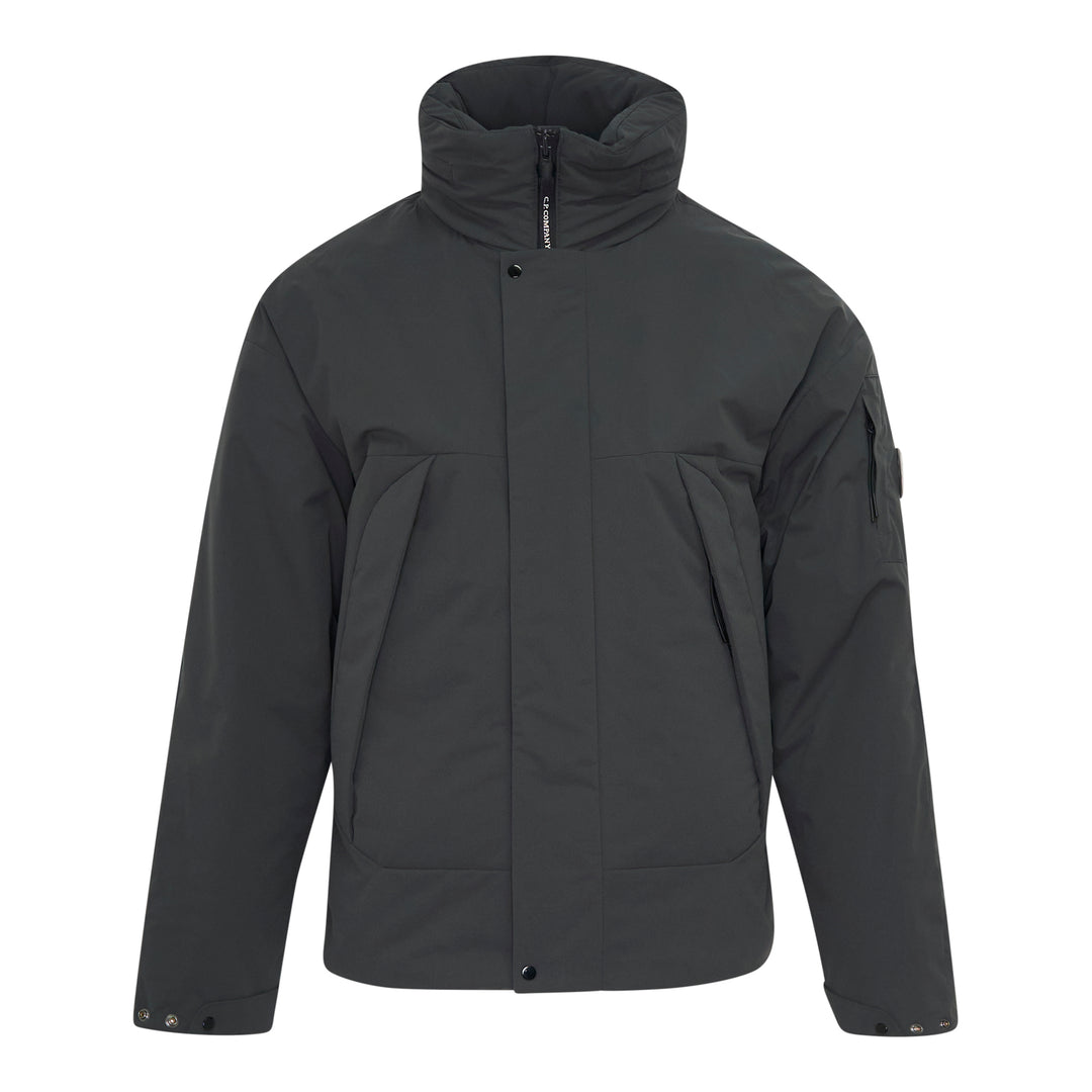 C.P. Company Pro-Tek Primaloft Silver Lens Jacket in dark grey, front view, featuring a padded high collar, snap-button storm placket, and signature goggle lens sleeve pocket