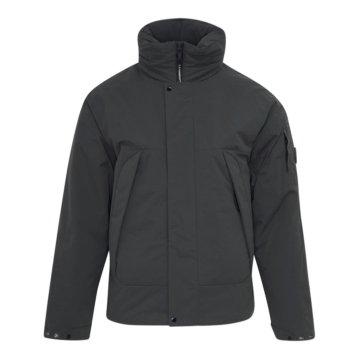 C.P. Company Pro-Tek Primaloft Silver Lens Jacket in dark grey, front view, featuring a padded high collar, snap-button storm placket, and signature goggle lens sleeve pocket