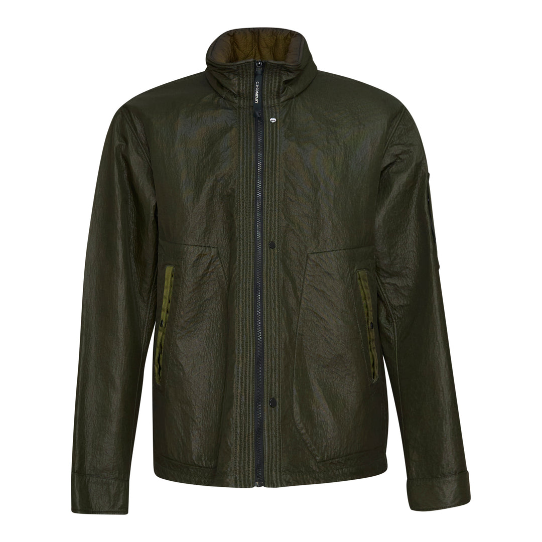 C.P. Company Bi-Face Reversible Jacket in olive coated technical nylon, featuring a stand collar, branded zip fastening, front zip pockets with webbing pulls, and a sleeve lens pocket detail